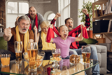 Image showing Excited, happy big family team watch football, soccer match together on the couch at home