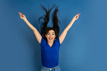 Image showing Caucasian woman\'s portrait isolated on blue studio background