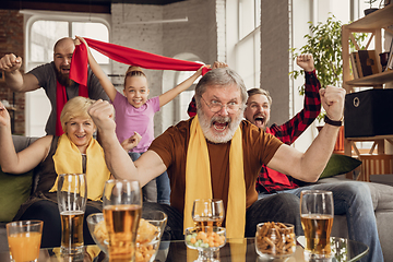 Image showing Excited, happy big family team watch football, soccer match together on the couch at home