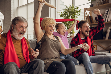 Image showing Excited, happy big family team watch football, soccer match together on the couch at home