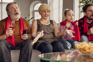 Image showing Excited, happy big family team watch football, soccer match together on the couch at home