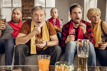 Image showing Excited, happy big family team watch football, soccer match together on the couch at home