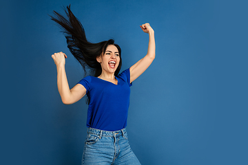 Image showing Caucasian woman\'s portrait isolated on blue studio background