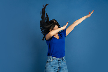 Image showing Caucasian woman\'s portrait isolated on blue studio background