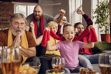 Image showing Excited, happy big family team watch football, soccer match together on the couch at home