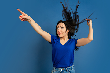 Image showing Caucasian woman\'s portrait isolated on blue studio background