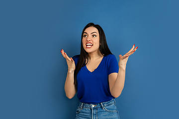 Image showing Caucasian woman\'s portrait isolated on blue studio background