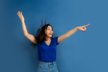 Image showing Caucasian woman\'s portrait isolated on blue studio background