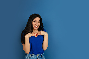 Image showing Caucasian woman\'s portrait isolated on blue studio background