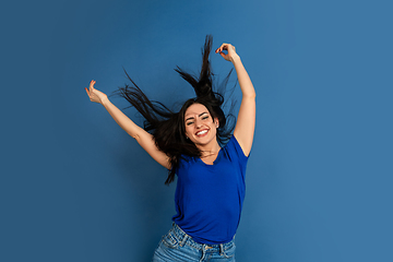 Image showing Caucasian woman\'s portrait isolated on blue studio background