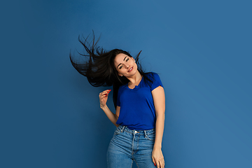 Image showing Caucasian woman\'s portrait isolated on blue studio background