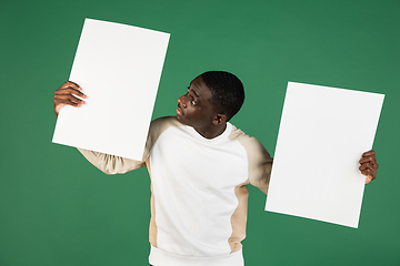 Image showing African man\'s portrait isolated on green studio background with copyspace