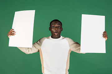 Image showing African man\'s portrait isolated on green studio background with copyspace