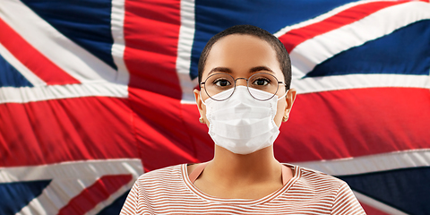 Image showing african woman in mask over flag of united kingdom