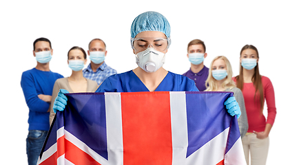 Image showing doctor in goggles and mask holding flag of england