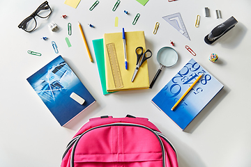 Image showing pink backpack with books and school supplies