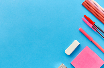 Image showing pink sticky notes, pens, pencils, clips and eraser