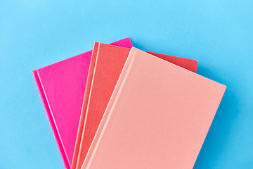 Image showing notebooks or books on blue background