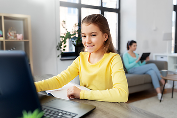 Image showing student girl with laptop learning online at home