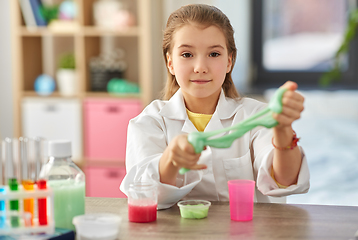 Image showing girl playing with slime at home laboratory