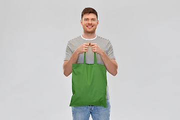 Image showing man with reusable canvas bag for food shopping