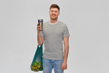 Image showing man with food in bag and tumbler or thermo cup