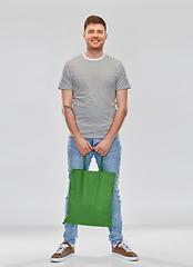 Image showing man with reusable canvas bag for food shopping