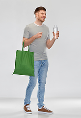 Image showing man with bag for food shopping and glass bottle