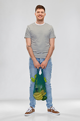 Image showing happy man with food in reusable net tote