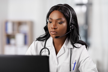 Image showing african doctor with headset and laptop at hospital