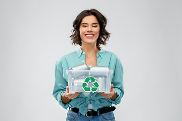 Image showing smiling young woman sorting metallic waste