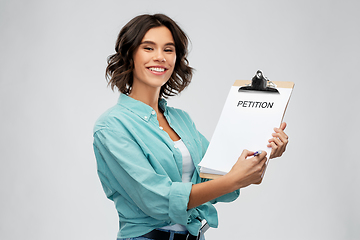 Image showing smiling woman with petition on clipboard and pen