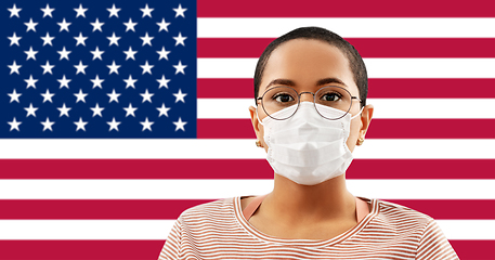 Image showing african american woman in mask on flag of america