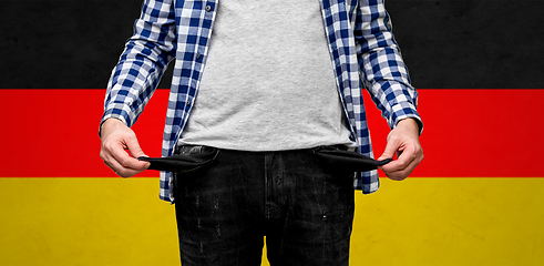 Image showing close up of man showing empty pockets