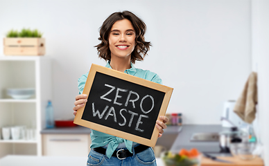 Image showing happy woman with chalkboard with zero waste words