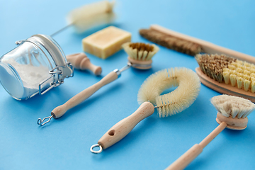 Image showing cleaning brushes and soda powder with scoop in jar