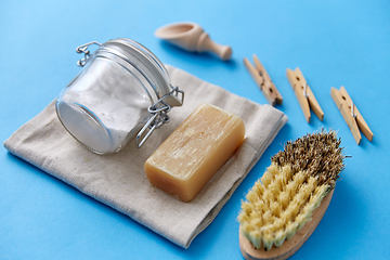 Image showing brush, washing soda, soap, scoop and clothespins