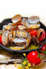 Image showing fresh clams on an iron skillet