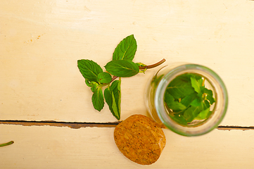 Image showing fresh mint leaves on a glass jar