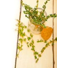 Image showing fresh thyme on a glass jar