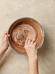 Image showing process of making dough for chocolate cake