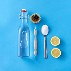 Image showing lemons, washing soda, bottle of vinegar and brush