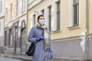 Image showing young woman wearing protective medical mask