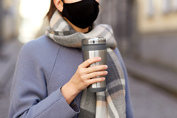 Image showing woman in reusable mask with tumbler in city