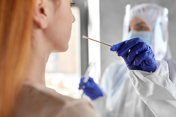 Image showing doctor in protective wear making coronavirus test