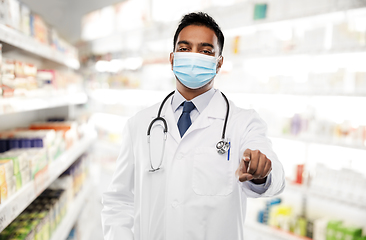 Image showing indian male doctor in mask pointing finger to you