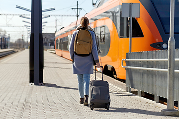 Image showing woman with travel bag on railway station