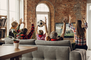 Image showing Excited, happy big family team watch sport match together on the couch at home