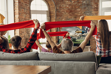 Image showing Excited, happy big family team watch sport match together on the couch at home