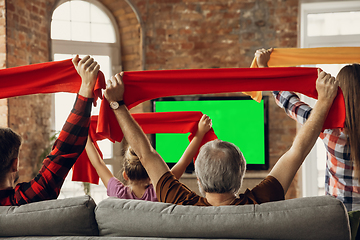 Image showing Excited, happy big family team watch sport match together on the couch at home